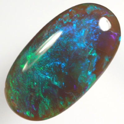 SOLID BLACK CRYSTAL OPAL Rolling flashes of green and turquoise purple fire